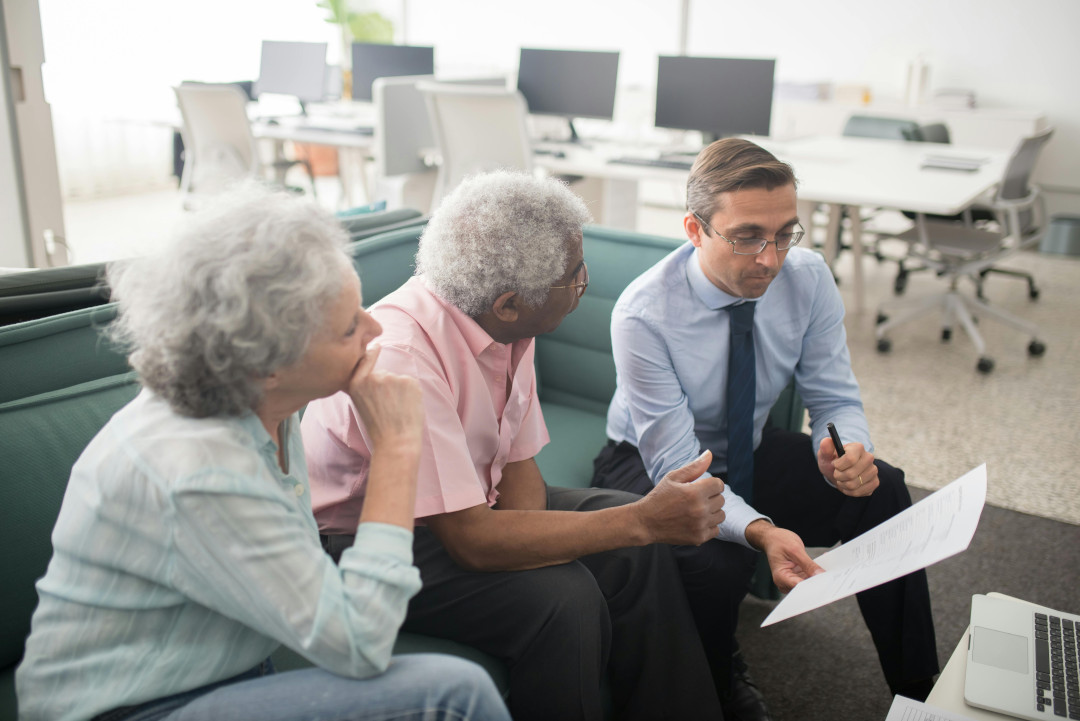 Photo of a couple speaking to an inheritance tax consultant